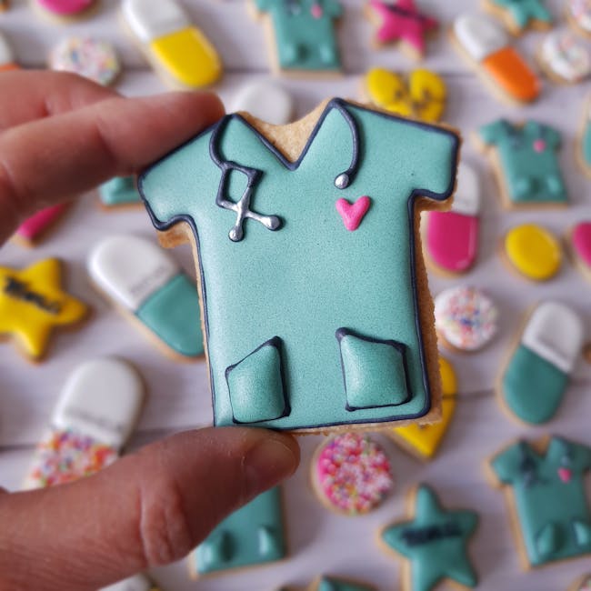 Close-up of a nurse-themed cookie with colorful desserts in the background.